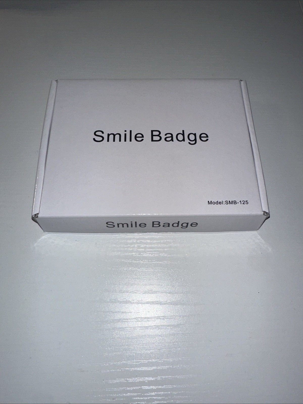 Amazon Smile Badge SEALED NEW SMB-125 Black Rechargeable Weatherproof