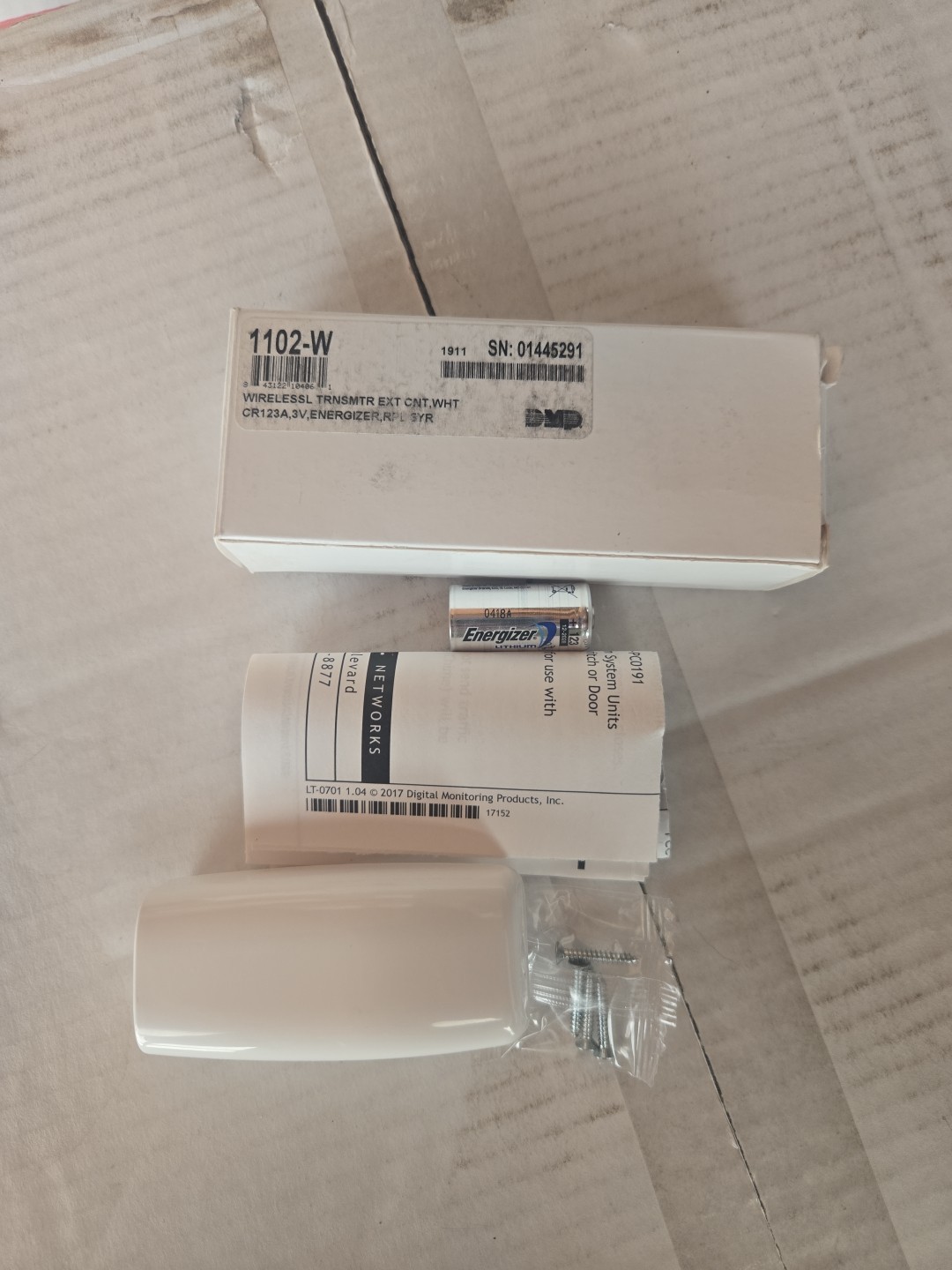 DMP 1102-W Universal Wireless Transmitter White CR123A Battery Included